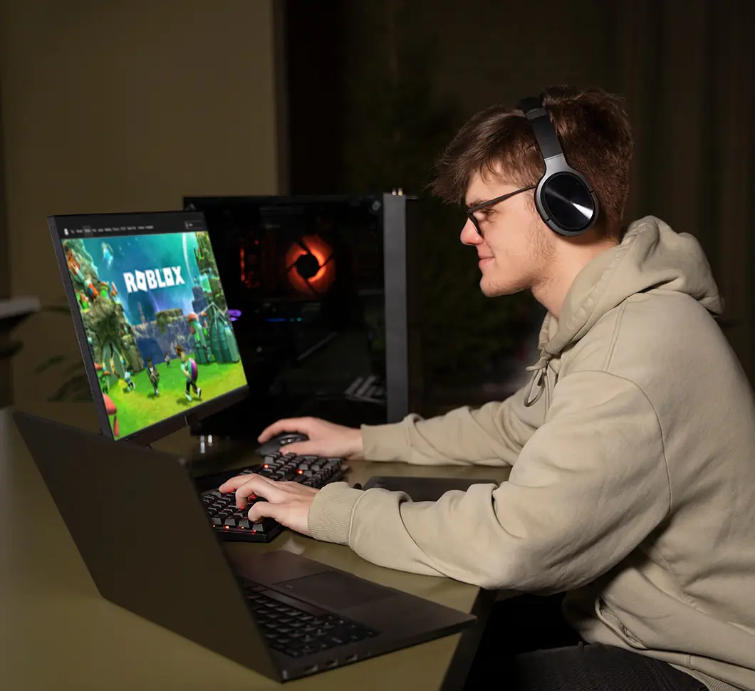 Roblox browser game with player using a laptop